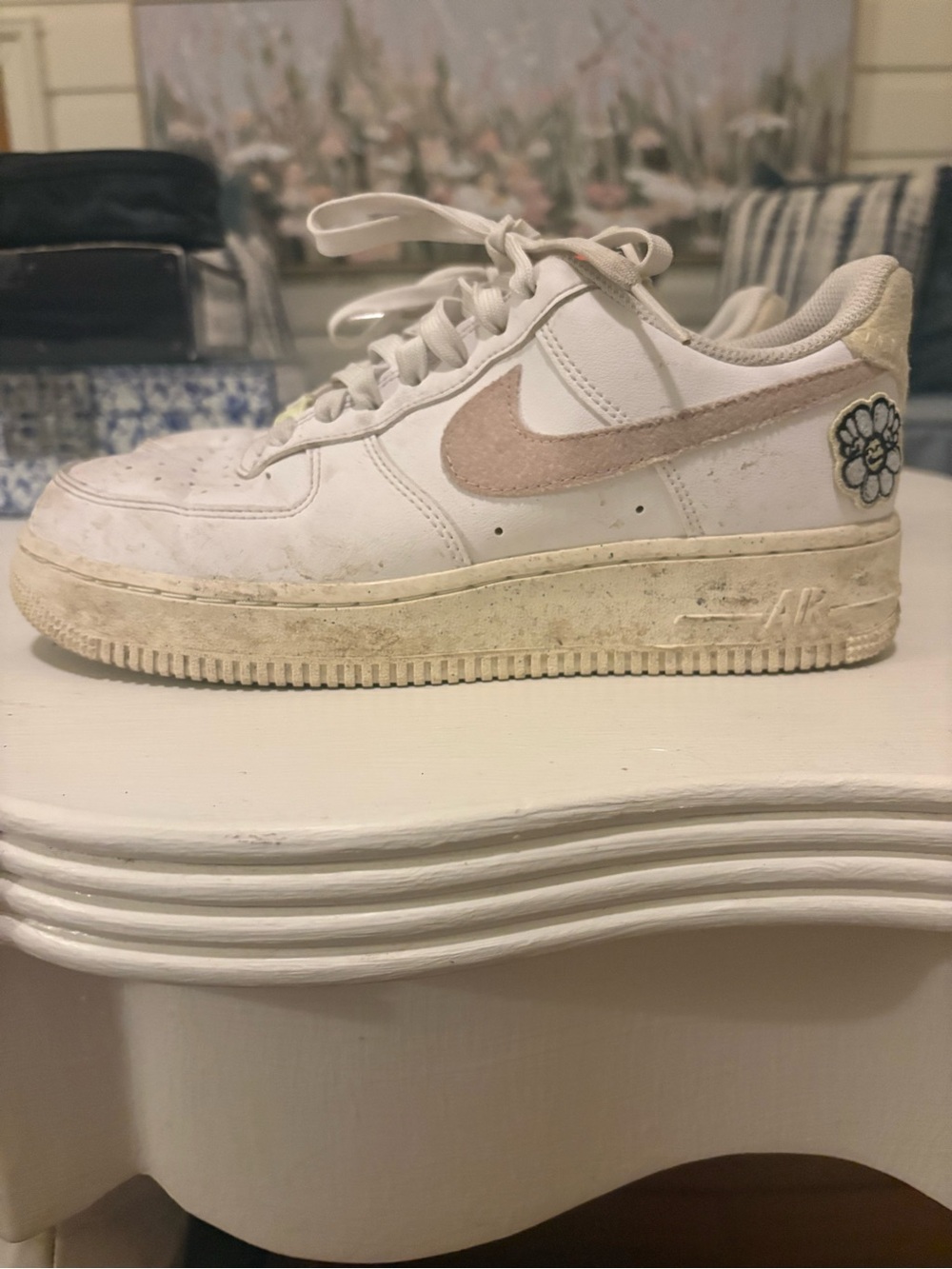 Nike Women’s White Airforces with pink swoop and flower/butterfly details